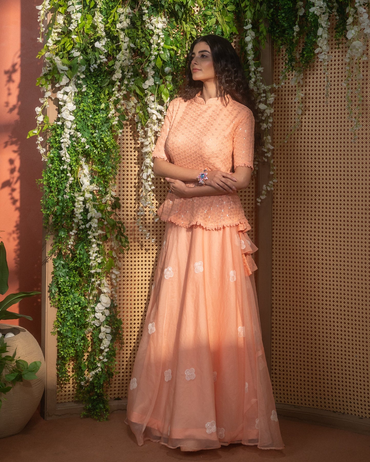 Peach Indo-Western peplum top with flared skirt