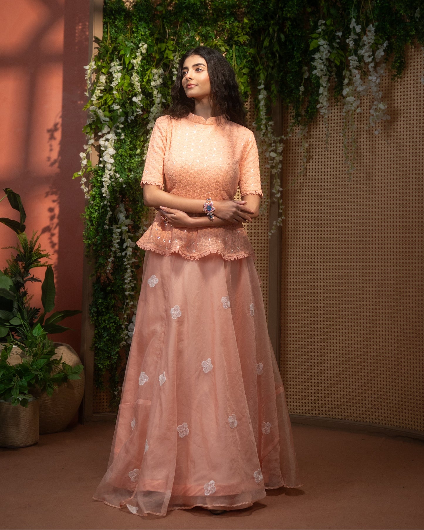 Peach Indo-Western peplum top with flared skirt
