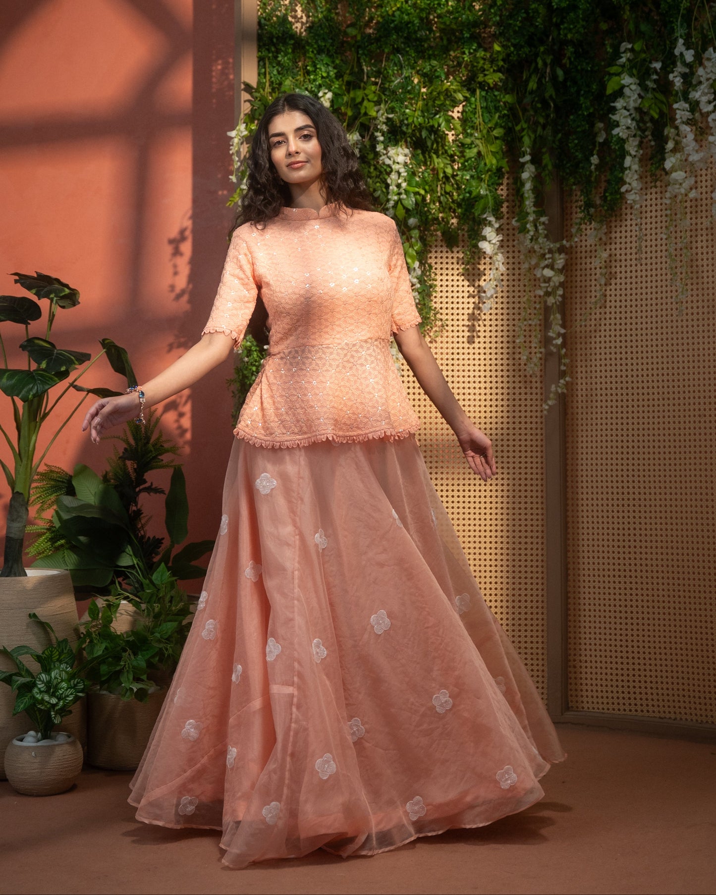 Peach Indo-Western peplum top with flared skirt