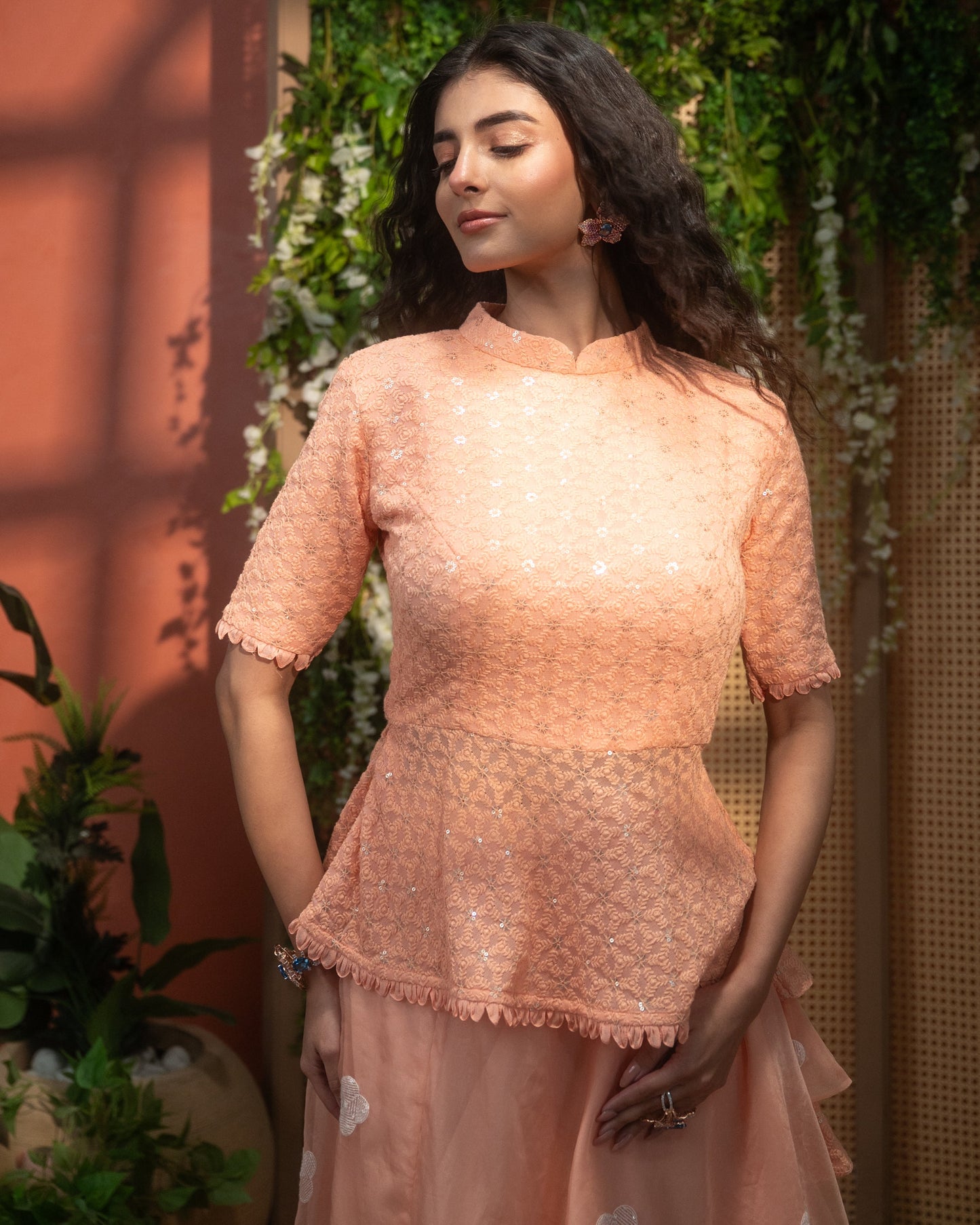Peach Indo-Western peplum top with flared skirt