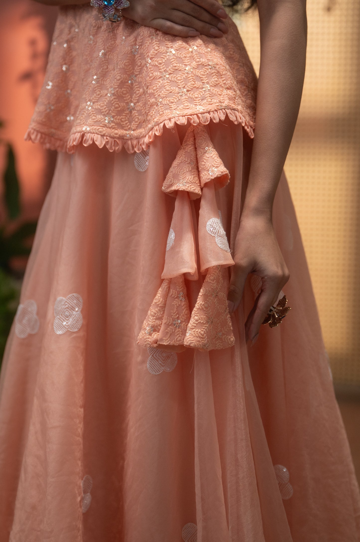 Peach Indo-Western peplum top with flared skirt